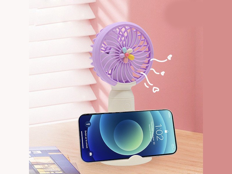 VENTIMOV — Handheld fan with smartphone holder designed to keep you cool anywhere